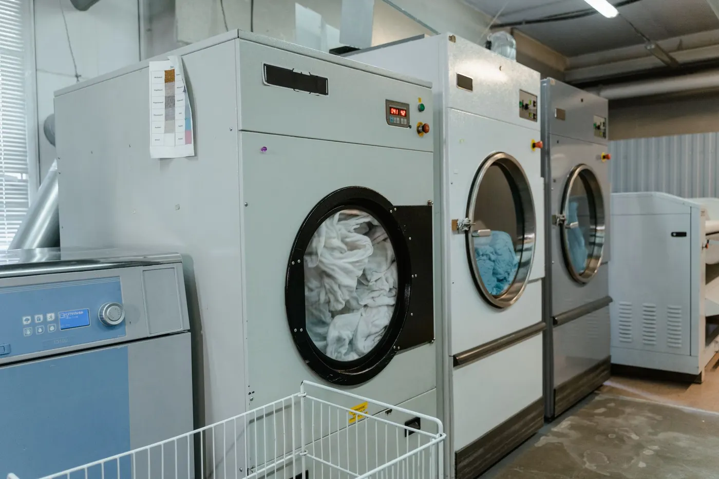 Stock photo of commercial laundry dryers in a row