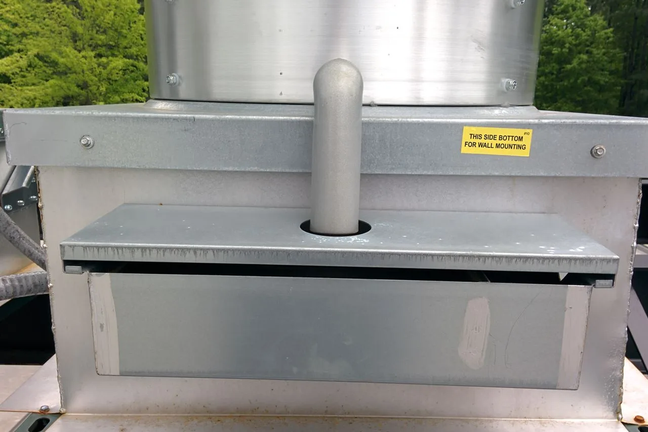 An upblast exhaust fan on a restaurant roof with a rooftop grease box, from CRC's own website